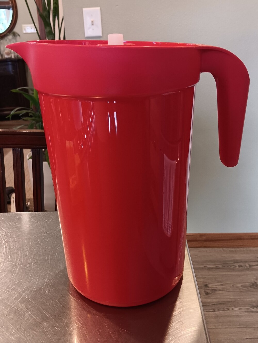 Red Plastic Tupperrwate Beverage Pitcher with Fruit Infuser. Not Used.